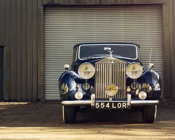 Beautiful antique car in front of a car storage unit
