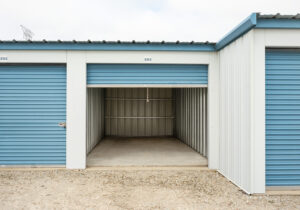 AllSeason_026 Interior view of an open drive-up storage unit at All Seasons Storage showing concrete floor and lighted space
