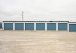 AllSeason_030 Row of drive-up self storage units with wide gravel access lanes near Muskego, WI