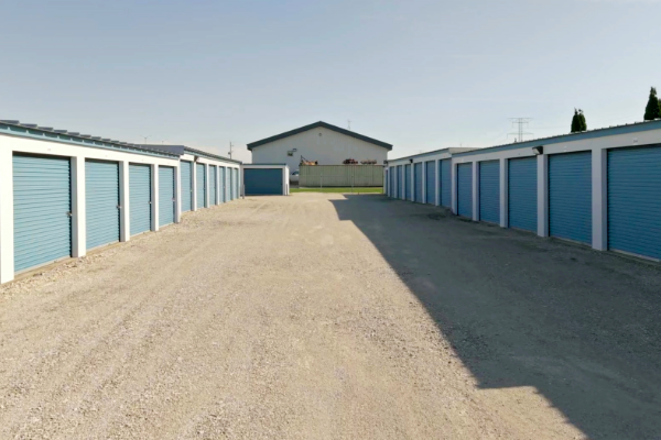Gravel center drive aisle between facing rows of self storage units near Muskego and Franklin, WI