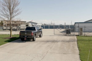 Screenshot Truck towing a camper trailer entering the gated facility at All Seasons Storage in Franksville, WI