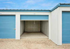 AllSeason_026a Open drive-up storage unit showing clean concrete floor and lighted interior at All Seasons Storage in Franksville, WI