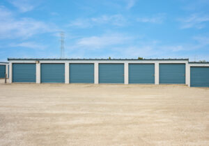 AllSeason_030a Row of drive-up self storage units with wide gravel access lanes near Muskego, WI